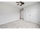 Bedroom with plush carpeting, neutral decor, a closet and doorway with views into other rooms at 162 Brookhaven Way, Rockmart, GA 30153