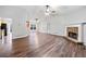 Bright living room featuring vaulted ceilings, sleek floors, and a cozy fireplace, perfect for relaxing or entertaining at 162 Brookhaven Way, Rockmart, GA 30153