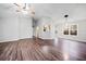 Bright living room with hardwood floors, a ceiling fan, and natural light from the window at 162 Brookhaven Way, Rockmart, GA 30153