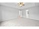 Large main bedroom with a ceiling fan and tray ceilings at 162 Brookhaven Way, Rockmart, GA 30153