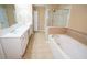 A spacious bathroom with a separate tub, shower, and double vanity at 2548 Gadsen Walk, Duluth, GA 30097
