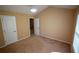 Neutral bedroom featuring tan carpet with white trim and an ensuite bathroom at 2548 Gadsen Walk, Duluth, GA 30097