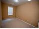 Cozy carpeted bedroom features natural light from a window with blinds at 2548 Gadsen Walk, Duluth, GA 30097
