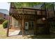 Exterior elevation featuring a brick facade and a large deck at 2548 Gadsen Walk, Duluth, GA 30097
