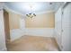 Elegant dining room with white trim, chandelier, and large window with blinds at 2548 Gadsen Walk, Duluth, GA 30097