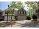 Charming two-story brick home with a two-car garage and well-maintained landscaping at 2548 Gadsen Walk, Duluth, GA 30097