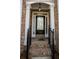 Inviting front entrance with a black door, brick facade, and decorative iron railings at 2548 Gadsen Walk, Duluth, GA 30097