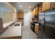 Functional kitchen featuring wooden cabinets, stainless steel appliances, and tile flooring at 2548 Gadsen Walk, Duluth, GA 30097