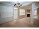 Open-concept living room featuring a fireplace, large windows, and a chandelier at 2548 Gadsen Walk, Duluth, GA 30097