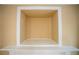 Close up of a built in wall nook with a small outlet and white trim at 2548 Gadsen Walk, Duluth, GA 30097