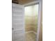 Walk-in pantry with wire shelving and ceramic tile flooring at 2548 Gadsen Walk, Duluth, GA 30097