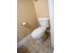 Neat powder room with white fixtures and tile flooring for the convenience of residents and guests at 2548 Gadsen Walk, Duluth, GA 30097