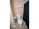 Bathroom with toilet, towel rack, tan paint, and ceramic tile flooring at 2548 Gadsen Walk, Duluth, GA 30097