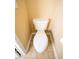 A close-up of a standard white toilet against a yellow wall at 2548 Gadsen Walk, Duluth, GA 30097