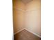 Carpeted walk-in closet with white wire shelving at 2548 Gadsen Walk, Duluth, GA 30097