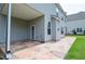 Spacious covered back patio with durable stone flooring offers a great outdoor living and entertaining area at 2589 Cajun Dr, Marietta, GA 30066