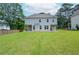 Spacious backyard showing covered patio, green grass and privacy fence at 2589 Cajun Dr, Marietta, GA 30066