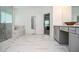 A luxurious bathroom featuring a marble tile shower, soaking tub and dual sink vanity at 2589 Cajun Dr, Marietta, GA 30066