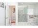 Bright bathroom featuring a glass enclosed shower, soaking tub and seperate toilet at 2589 Cajun Dr, Marietta, GA 30066