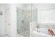 Bright bathroom featuring a glass enclosed shower and soaking tub at 2589 Cajun Dr, Marietta, GA 30066