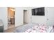 This bedroom features neutral walls, a large wall-mounted TV, and an ensuite bathroom for added convenience at 2589 Cajun Dr, Marietta, GA 30066
