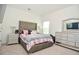 Bedroom featuring a large bed with a tufted headboard at 2589 Cajun Dr, Marietta, GA 30066