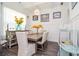 Elegant dining room with modern lighting, wainscoting, and a table set for six at 2589 Cajun Dr, Marietta, GA 30066