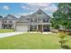 Beautiful two-story home featuring brick accents, a well-manicured lawn, and a two-car garage at 2589 Cajun Dr, Marietta, GA 30066