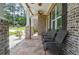 Inviting front porch with decorative brick columns and comfortable seating arrangement at 2589 Cajun Dr, Marietta, GA 30066