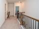 Hallway with a decorative iron railing, carpet, and neutral paint at 2589 Cajun Dr, Marietta, GA 30066