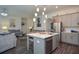 Open concept kitchen with stainless steel dishwasher and gray cabinets at 2589 Cajun Dr, Marietta, GA 30066