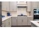 Modern kitchen features white countertops, white subway tile and stainless steel appliances at 2589 Cajun Dr, Marietta, GA 30066