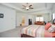 Spacious main bedroom suite with tray ceiling, sitting area, and access to the main bathroom at 2589 Cajun Dr, Marietta, GA 30066
