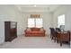 Inviting sitting area with a sofa, desk, and chest of drawers, perfect for relaxation or work at 2589 Cajun Dr, Marietta, GA 30066