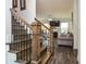 Inviting staircase with wood treads and iron balusters leading to a cozy living room at 2589 Cajun Dr, Marietta, GA 30066