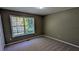 A bedroom with carpet flooring and a window at 510 Ward Rd, Ellenwood, GA 30294