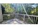 Wooden deck overlooking a lush, wooded backyard providing scenic views at 510 Ward Rd, Ellenwood, GA 30294