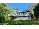 Rear exterior showing a two-story home with deck and well-maintained lawn at 510 Ward Rd, Ellenwood, GA 30294