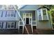 Inviting entrance with well maintained stairway and well-manicured garden at 510 Ward Rd, Ellenwood, GA 30294