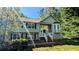 Charming two story house with light siding and a lovely front yard at 510 Ward Rd, Ellenwood, GA 30294