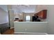 A kitchen featuring a breakfast bar and a view into an adjacent living room area at 510 Ward Rd, Ellenwood, GA 30294