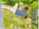 Aerial view of the property showcasing the home's layout, driveway, and surrounding landscape at 3152 Normandy Ne Cir, Marietta, GA 30062