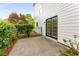 Small, fenced patio with a sliding door and shrubbery along the fence at 3152 Normandy Ne Cir, Marietta, GA 30062
