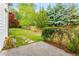 A lush backyard with mature trees, a patio, and landscaping at 3152 Normandy Ne Cir, Marietta, GA 30062