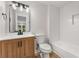 Updated bathroom featuring a wood vanity, subway tile, and a shower-tub combo at 3152 Normandy Ne Cir, Marietta, GA 30062