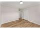 Bedroom showing hardwood floor, fresh paint, white trim, and a closet at 3152 Normandy Ne Cir, Marietta, GA 30062