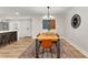Dining room showcasing modern lighting and an open floor plan connecting to the kitchen and dining table at 3152 Normandy Ne Cir, Marietta, GA 30062