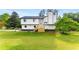 Modern two-story home with new wooden steps, black trim, and a well-manicured lawn at 3152 Normandy Ne Cir, Marietta, GA 30062