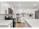 Modern kitchen featuring stainless steel appliances, white cabinets, and a stylish backsplash at 3152 Normandy Ne Cir, Marietta, GA 30062