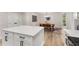 Bright kitchen with white cabinets, quartz countertops and a modern dining area at 3152 Normandy Ne Cir, Marietta, GA 30062